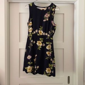 Mini floral dress with open back.